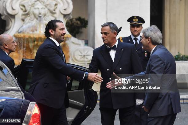 Italian Prime Minister Paolo Gentiloni welcomes his Lebanese counterpart Saad Hariri before their meeting on October 16, 2017 at the Palazzo Chigi in...