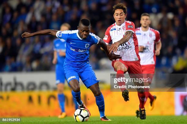 Ally Mbwana Samatta forward of KRC Genk battles for the ball with Frank Boya midfielder of Royal Excel Mouscron during the Jupiler Pro League match...