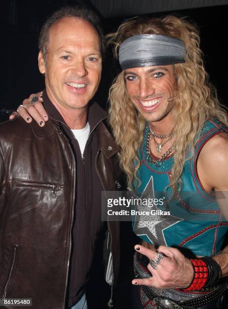 Michael Keaton and James Carpinello pose backstage at "Rock of Ages" on Broadway at The Brooks Atkinson Theater on April 23, 2009 in New York City.