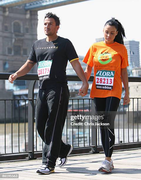 Katie Price with her husband Peter Andre during a 'Celebrity Marathon Runners' photocall outside Tower Bridge Hotel on April 24, 2009 in London,...