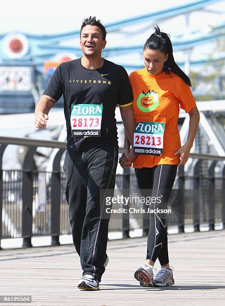 Katie Price with her husband Peter Andre during a 'Celebrity Marathon Runners' photocall outside Tower Bridge Hotel on April 24, 2009 in London,...