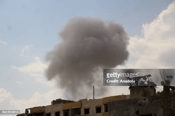 Smoke rises after Assad regime's airstrikes hit residential areas of the de-conflict zone in Ein Tarma town of Eastern Ghouta of Damascus, Syria on...