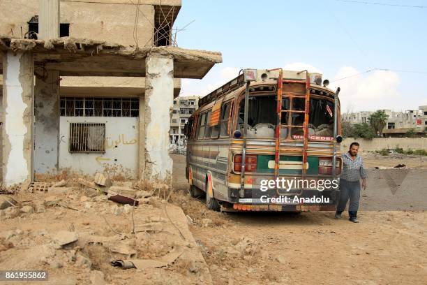 Debris of damaged buildings are seen after Assad regime's airstrikes hit residential areas of the de-conflict zone in Ein Tarma town of Eastern...