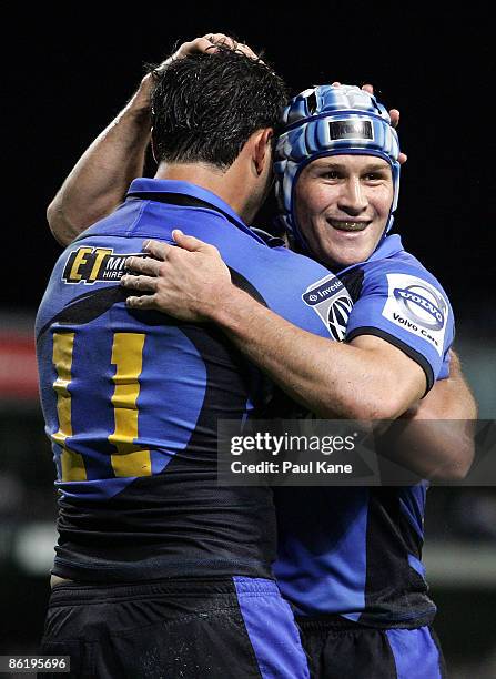 Matt Giteau and Cameron Shepherd of the Force celebrate a try during the round 11 Super 14 match between the Western Force and the Lions at Subiaco...