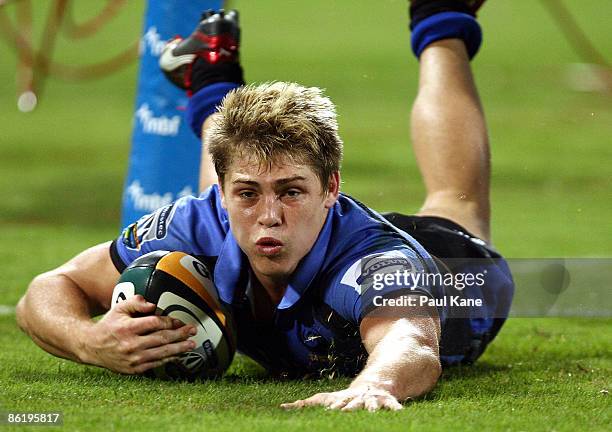 James O'Connor of the Force dives for a try during the round 11 Super 14 match between the Western Force and the Lions at Subiaco Oval on April 24,...