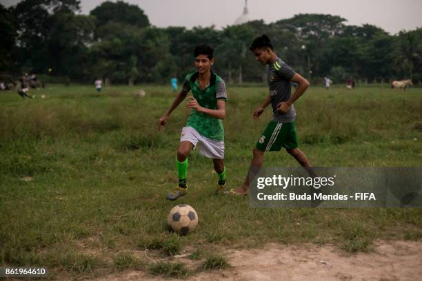 Local young children play football in a park ahead of the FIFA U-17 World Cup India 2017 tournament on October 16, 2017 in Kolkata, India.