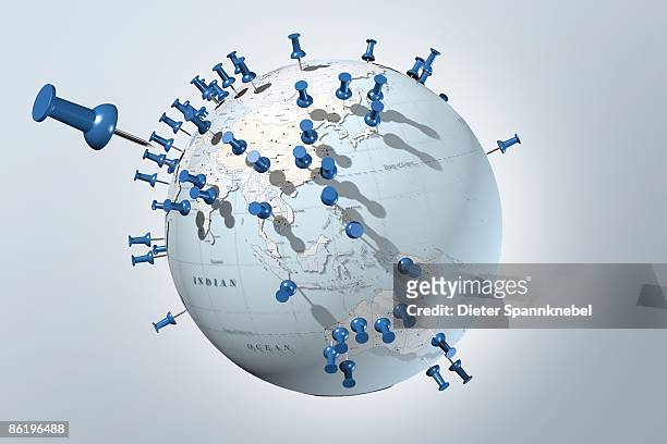 globe blotched with blue pin needles - pin stock illustrations