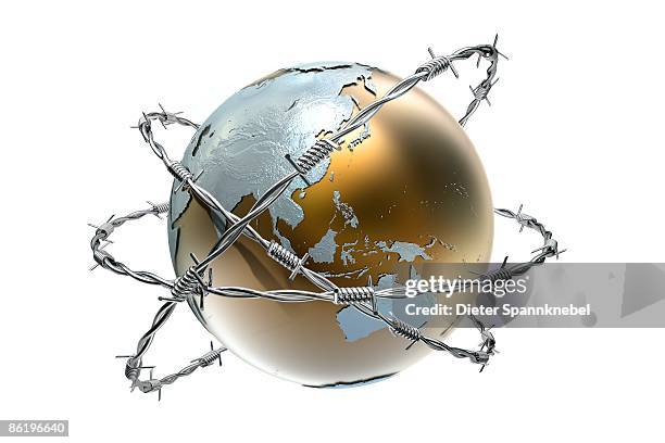 globe shows asia australia wrapped with barbwire - barbed wire stock illustrations