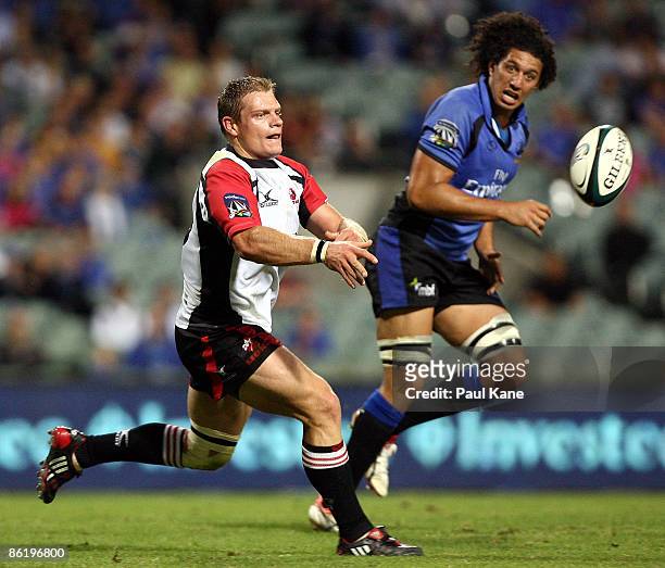 Deon Van Rensburg of the Lions passes the ball during the round 11 Super 14 match between the Western Force and the Lions at Subiaco Oval on April...