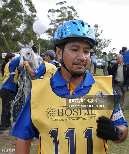 The King of Malaysia Sultan Mizan Zainal Abidin waits for his horse during the Panamerican Endurance Horse ride in Costa Azul beach, 60 km east from...