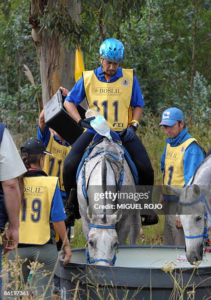 The King of Malaysia Sultan Mizan Zainal Abidin waters his horse during the Panamerican Endurance Horse ride in Costa Azul beach, 60 km east from...
