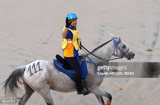 The King of Malaysia Sultan Mizan Zainal Abidin waves to public as he rides his horse during the Pan-American Endurance Horse ride in Costa Azul...
