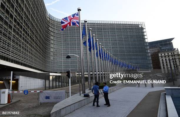 Union Jack flag flies in front of the European Commission building as British Prime Minister May is due to meet European Commission President Juncker...