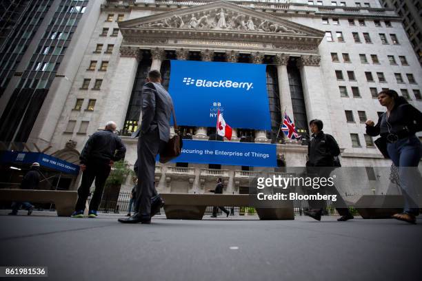 BlackBerry Ltd. Signage is displayed in front of the New York Stock Exchange during the company's listing migration to the NYSE in New York, U.S., on...