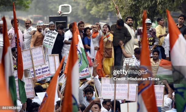 Delhi Congress Chief Ajay Maken with party workers protests against Election Commission for not announcing the dates of Gujarat Assembly elections at...