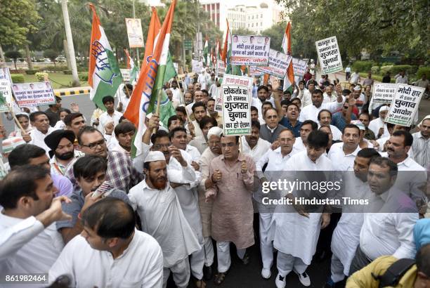 Delhi Congress Chief Ajay Maken with party workers protests against Election Commission for not announcing the dates of Gujarat Assembly elections at...