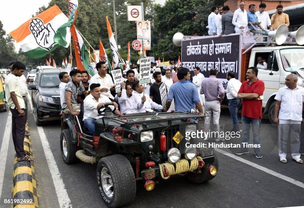 Delhi Congress Chief Ajay Maken with party workers protests against Election Commission for not announcing the dates of Gujarat Assembly elections at...