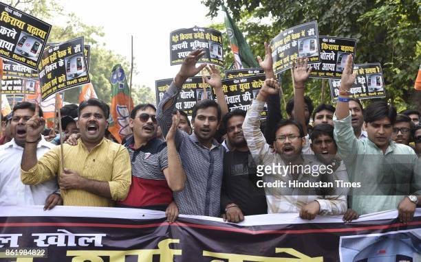 Delhi BJP Yuva Morcha President Sunil Yadav with youth activists protests against hike in Metro fare by Delhi Government, near Delhi CM Arvind...