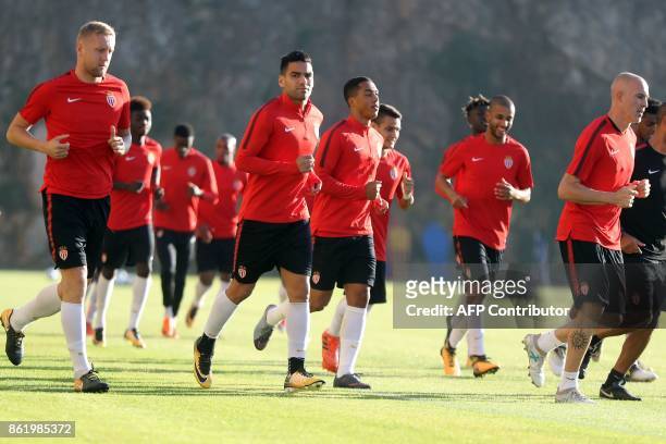 Monaco's Colombian forward Radamel Falcao , Monaco's Italian defender Andrea Raggi and Monaco's Polish defender Kamil Glik attend a training session...
