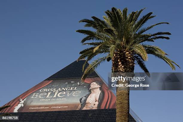 Large billboard promoting the "Criss Angel Cirque du Soleil" show is seen on the side of the Luxor Hotel pyramid in this street level 2009 Las Vegas,...