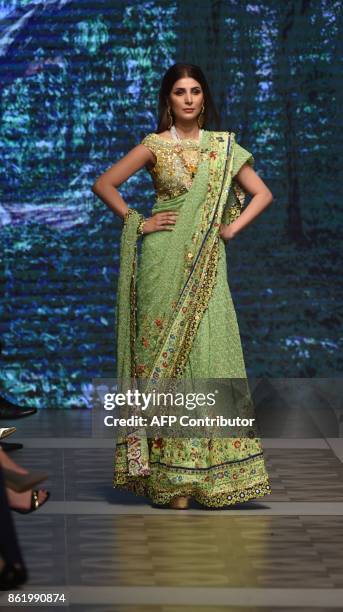 Model presents a creation of a Pakistani designer Tabya Khan during the final day of the Pakistan Fashion Design Council LOreal Paris Bridal Week in...