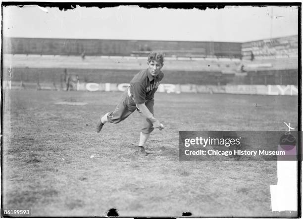 Jones, a fielder for the Chicago White Sox, American League, holding ball, warming up in the outfield at South Side Park in the Armour Square...