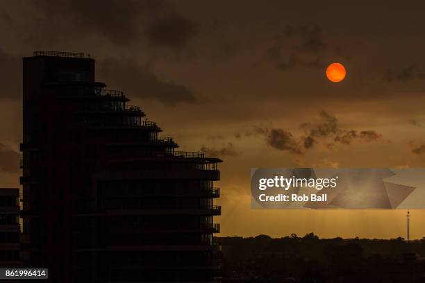 The sun goes a golden yellow colour over Putney due to dust from the Sahara being blown in with Storm Ophelia on October 16, 2017 in Putney, London,...
