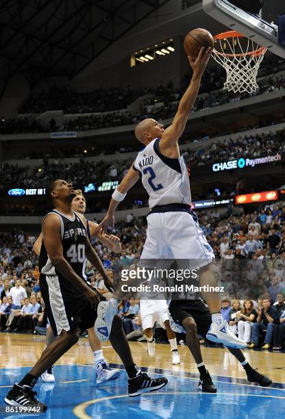 Guard Jason Kidd of the Dallas Mavericks takes a shota against Kurt Thomas of the San Antonio Spurs in Game Three of the Western Conference...