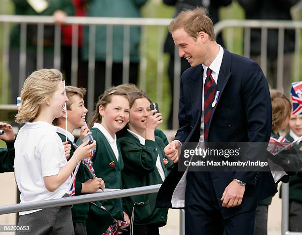 Prince William meets with school children as he visits the National Memorial Arboretum to launch the NMA Future Foundations Appeal on April 24, 2009...