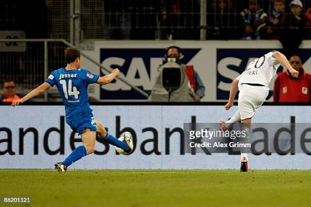 Patrick Ebert of Berlin scores his team's first goal against Christoph Janker of Hoffenheim during the Bundesliga match between TSG 1899 Hoffenheim...