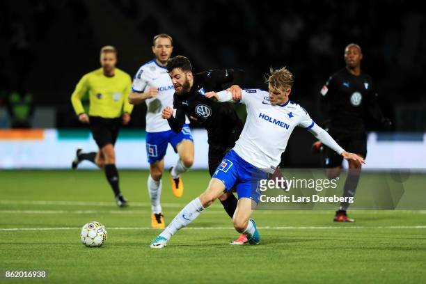 Erdal Rakip of Malmo FF and Eric Smith of IFK Norrkoping competes for the ball during the Allsvenskan match between IFK Norrkoping and Malmo FF at...