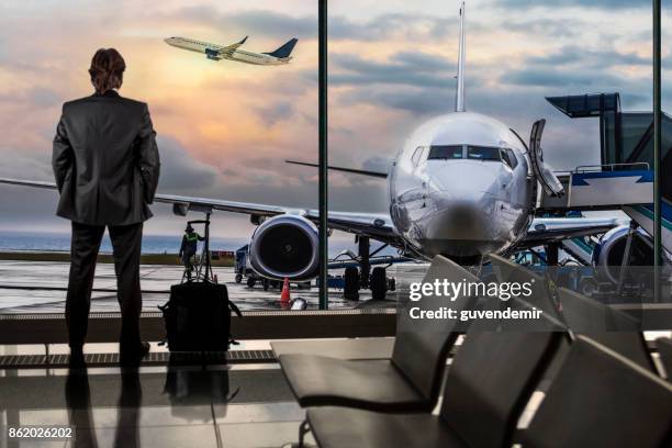 man waiting for flight in airport lounge - business journey stock pictures, royalty-free photos & images