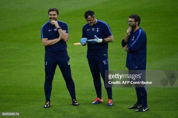 Tottenham Hotspur's assitant coach Miguel D'Agostino, goalkeeping coach Toni Jimenez and fitness coach Nathan Gardiner attend a training session in...