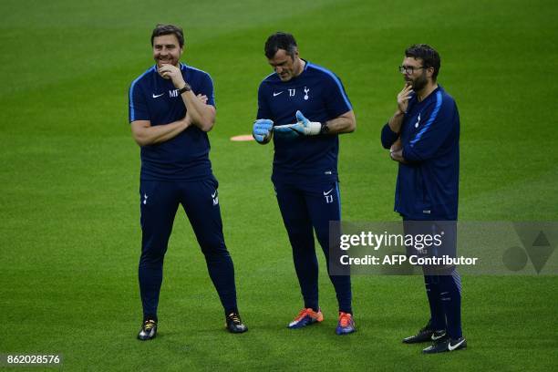 Tottenham Hotspur's assitant coach Miguel D'Agostino, goalkeeping coach Toni Jimenez and fitness coach Nathan Gardiner attend a training session in...