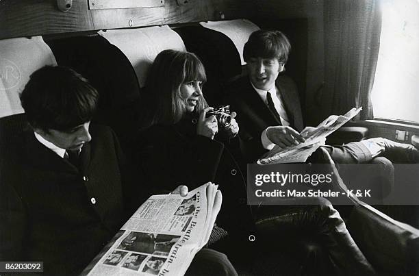 Photo of John LENNON and Astrid KIRCHHERR and BEATLES; L-R: Ringo Starr, Astrid Kirchherr & John Lennon - sitting on train during the filming of "A...