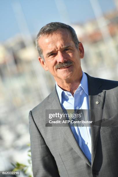 Canadian astronaut Chris Hadfield poses during the MIPCOM trade show in Cannes, southern France, on October 16, 2017. / AFP PHOTO / YANN COATSALIOU