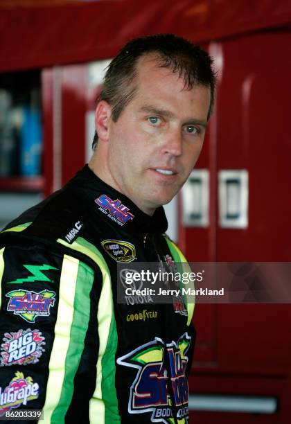 Jeremy Mayfield, driver of the All Sport Body Quencher Toyota, waits in the garage area during practice for the NASCAR Sprint Cup Series Aaron's 499...