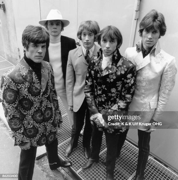 The Bee Gees pose for a group shot, Vince Melouney, Colin Petersen, Robin Gibb, Maurice Gibb and Barry Gibb outside a TV studio in 1968 in Hamburg,...