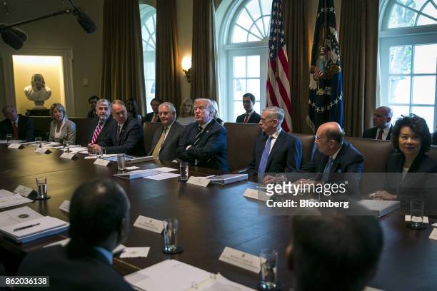 President Donald Trump, center, speaks during a cabinet meeting at the White House in Washington, D.C., U.S., on Monday, Oct. 16, 2017. Trump said...