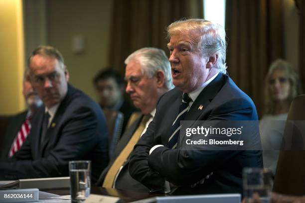 President Donald Trump, right, speaks during a cabinet meeting at the White House in Washington, D.C., U.S., on Monday, Oct. 16, 2017. Trump said...