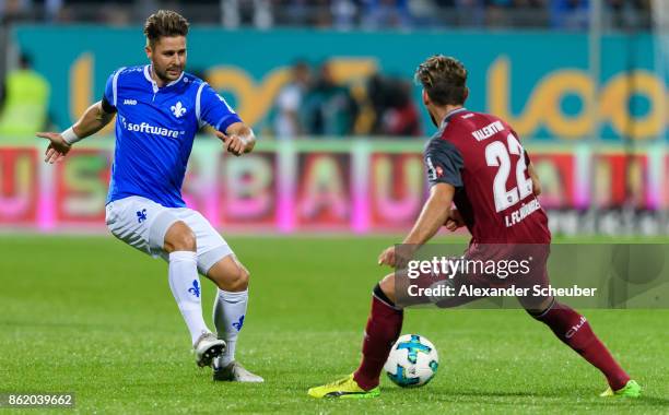 Markus Steinhoefer of Darmstadt in action against Enrico Valentini of Nuernberg during the Second Bundesliga match between SV Darmstadt 98 and 1. FC...