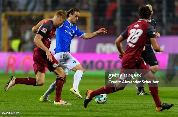 Yannick Stark of Darmstadt in action against Hanno Behrens of Nuernberg during the Second Bundesliga match between SV Darmstadt 98 and 1. FC...