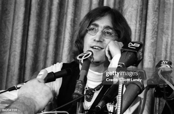 Photo of John LENNON and BEATLES; John Lennon at the press conference to launch Apple