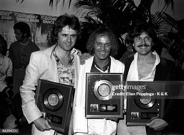 Photo of GOOMBAY DANCE BAND; Group portrait - Oliver Bendt receiving Gold discs