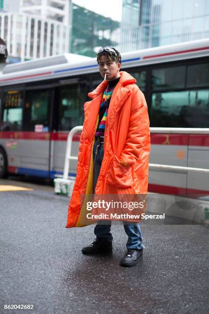 Guest is seen attending Asia Fashion Collection during Tokyo Fashion Week wearing a red and neon avant garde outfit on October 15, 2017 in Tokyo,...