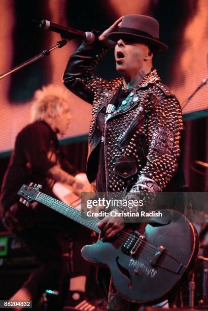 Photo of RANCID; Rancid singer Tim Armstrong performing at the KROQ Almost Acoustic Christmas concert held at the Universal Amphitheatre in Los...