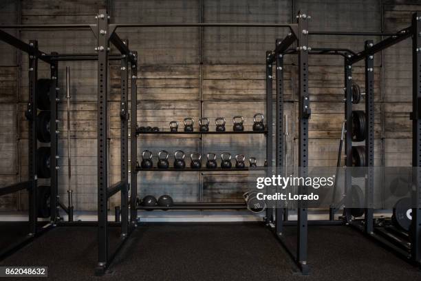 kettlebells in gym setting - gym equipment stock pictures, royalty-free photos & images