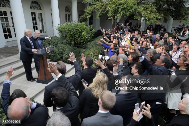 President Donald Trump calls on reporters with Senate Majority Leader Mitch McConnell in the Rose Garden following a lunch meeting at the White House...