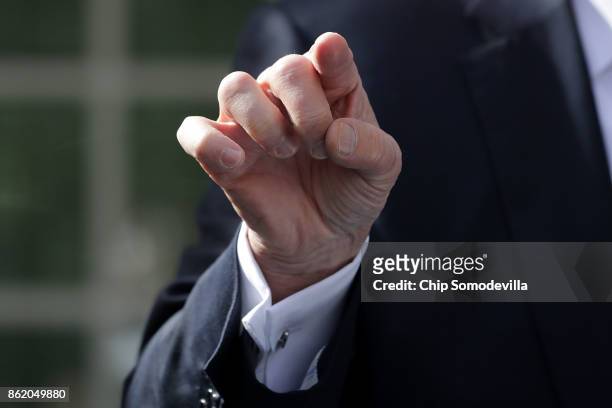 President Donald Trump gestures while speaking to reporters in the Rose Garden following a lunch meetering with Senate Majority Leader Mitch...