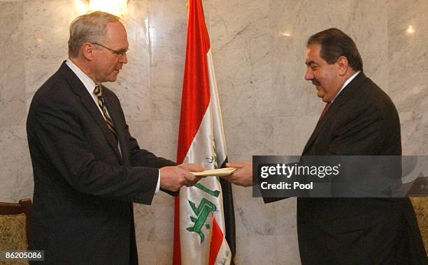 Diplomat Christopher Hill presents his credentials to Iraqi Foreign Minister Hoshyar Zebari at the Foreign Ministry in Baghdad on April 24 2009 in...